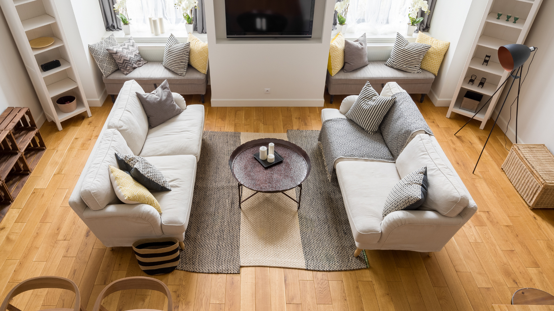 a living room with light brown hardwood floors